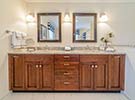 A large custom vanity with a granite countertop will give you all the space you need