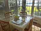 The dining area in the sunroom is the perfect place for breakfast with a view